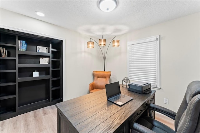 3005 Elmira Ct, Independence, MO 64057 - office area featuring wood finished floors and a textured ceiling