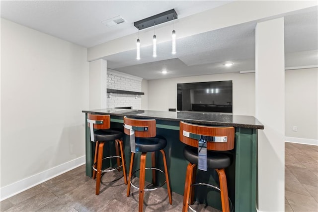 3005 Elmira Ct, Independence, MO 64057 - bar with tile patterned flooring and recessed lighting