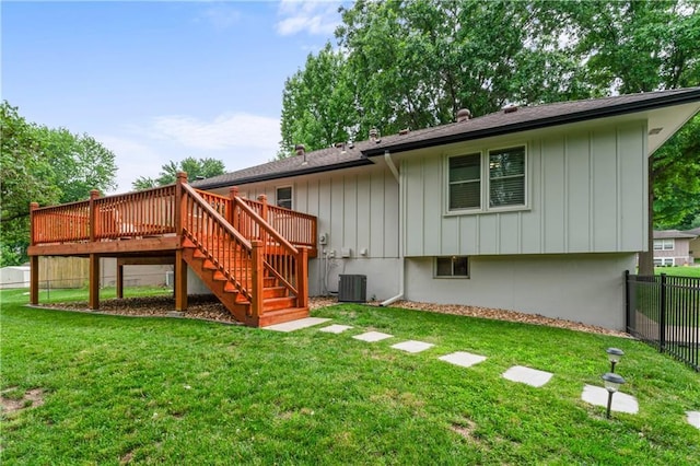 3005 Elmira Ct, Independence, MO 64057 - back of house with a wooden deck, stairs, and board and batten siding