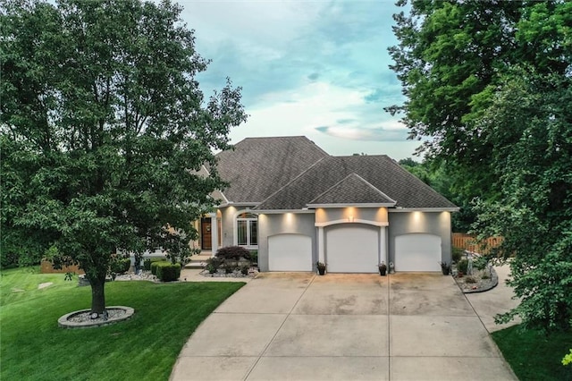 3401 NE 153rd Ter, Smithville, MO 64089 - view of front of house featuring an attached garage, roof with shingles, stucco siding, driveway, and a front yard