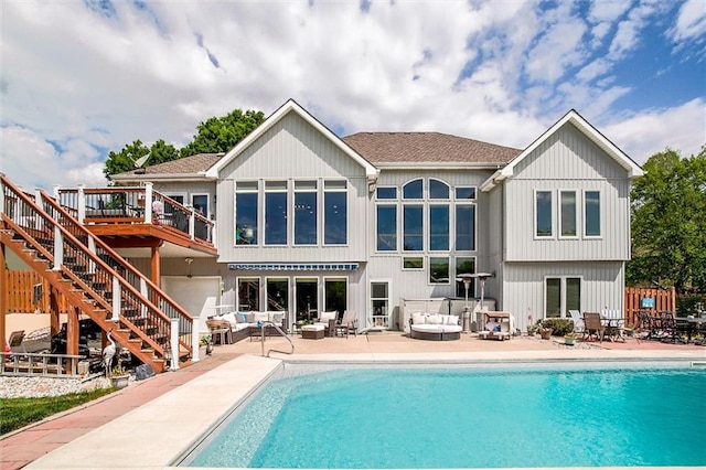 3401 NE 153rd Ter, Smithville, MO 64089 - rear view of house featuring an outdoor hangout area, stairs, an outdoor pool, a deck, and a patio area