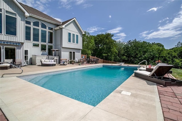 3401 NE 153rd Ter, Smithville, MO 64089 - swimming pool featuring a patio and an outdoor living space