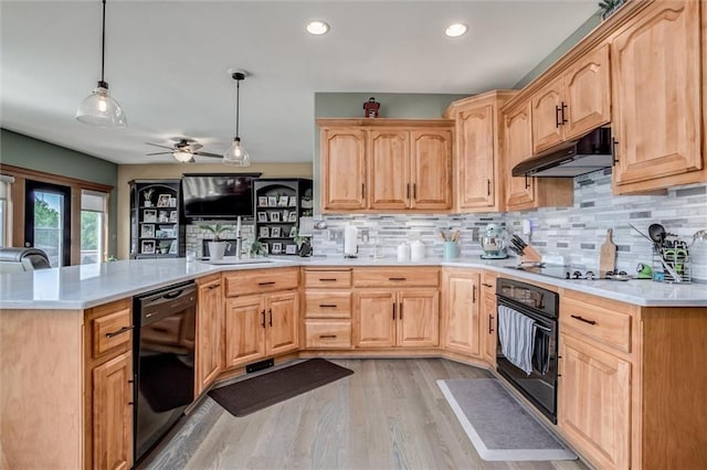 3401 NE 153rd Ter, Smithville, MO 64089 - kitchen featuring black appliances, light brown cabinetry, under cabinet range hood, a peninsula, and light countertops