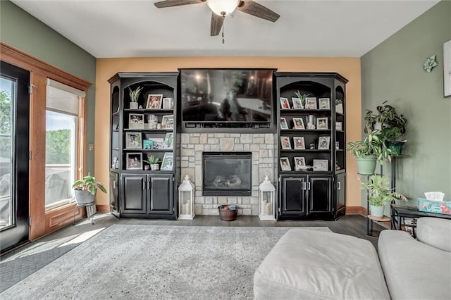 3401 NE 153rd Ter, Smithville, MO 64089 - living area featuring ceiling fan and a stone fireplace