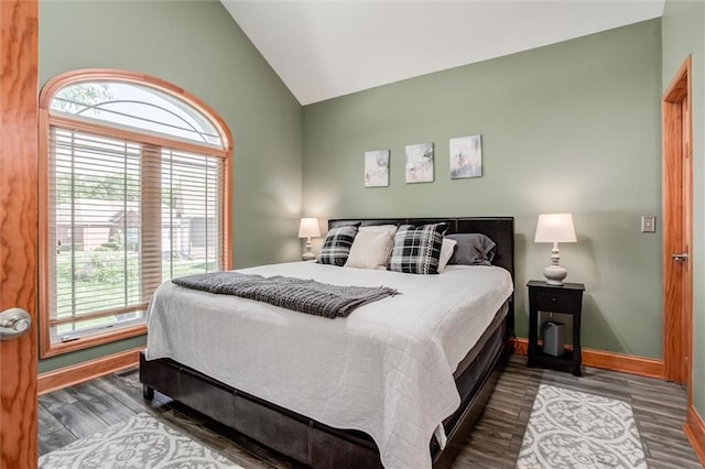 3401 NE 153rd Ter, Smithville, MO 64089 - bedroom with multiple windows, vaulted ceiling, and wood finished floors