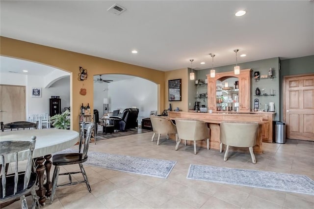3401 NE 153rd Ter, Smithville, MO 64089 - kitchen with arched walkways, recessed lighting, a ceiling fan, light tile patterned floors, and pendant lighting