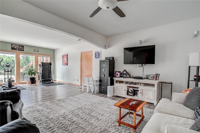 3401 NE 153rd Ter, Smithville, MO 64089 - living room with a ceiling fan, wood finished floors, and beam ceiling