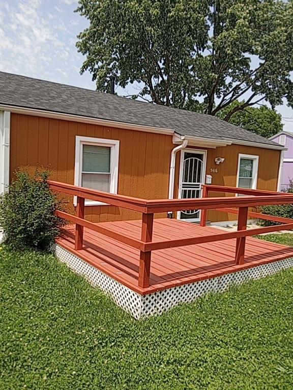 5416 College Ave, Kansas City, MO 64130 - deck with a yard