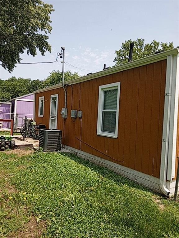 5416 College Ave, Kansas City, MO 64130 - view of side of home featuring a central air condition unit