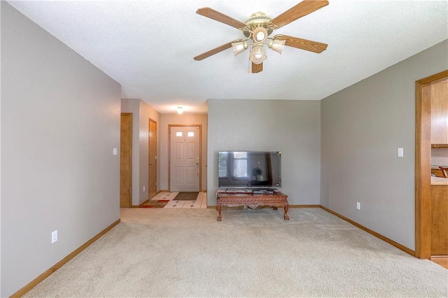 1705 N Jones Ct, Independence, MO 64056 - carpeted living room featuring a ceiling fan and baseboards