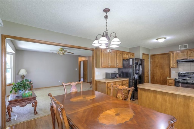 1705 N Jones Ct, Independence, MO 64056 - dining space with a textured ceiling, ceiling fan, and wood finished floors