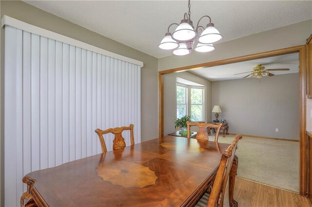 1705 N Jones Ct, Independence, MO 64056 - dining room featuring a chandelier, light wood-style floors, and ceiling fan