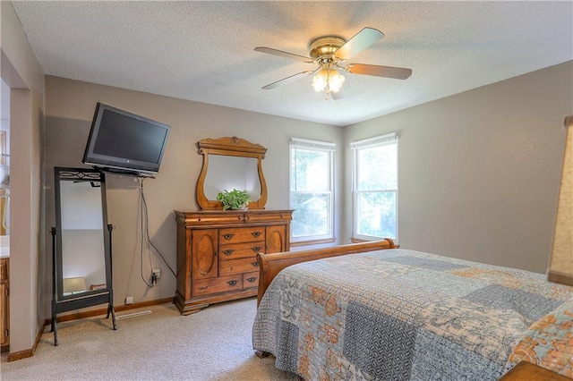 1705 N Jones Ct, Independence, MO 64056 - bedroom with light colored carpet, a textured ceiling, and ceiling fan