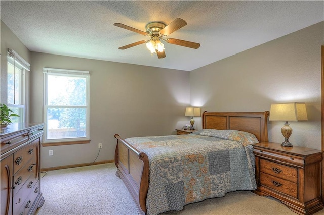 1705 N Jones Ct, Independence, MO 64056 - bedroom with light colored carpet, a textured ceiling, and ceiling fan