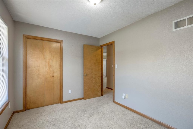 1705 N Jones Ct, Independence, MO 64056 - unfurnished bedroom featuring a closet and carpet