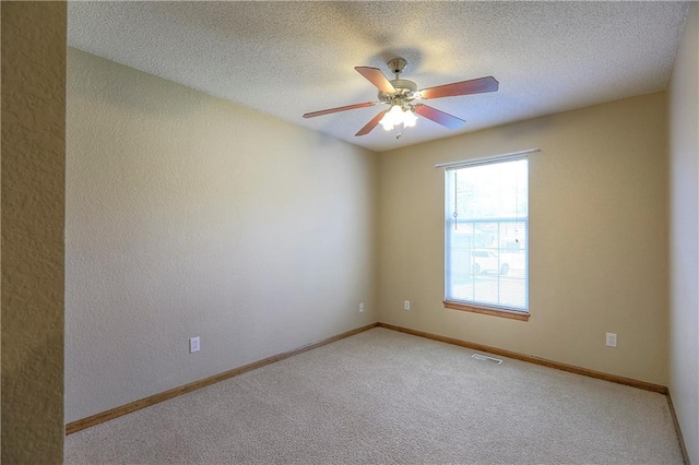 1705 N Jones Ct, Independence, MO 64056 - carpeted empty room featuring ceiling fan and a textured ceiling