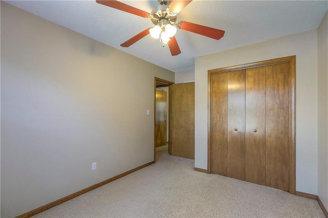 1705 N Jones Ct, Independence, MO 64056 - unfurnished bedroom with light carpet, a closet, and a ceiling fan