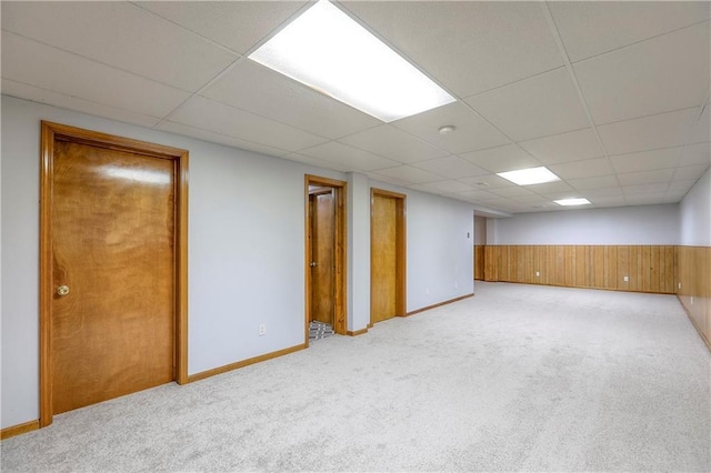 1705 N Jones Ct, Independence, MO 64056 - finished basement featuring carpet flooring, a paneled ceiling, wainscoting, and wooden walls
