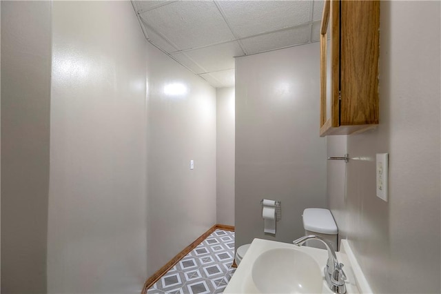 1705 N Jones Ct, Independence, MO 64056 - bathroom featuring a drop ceiling and a sink