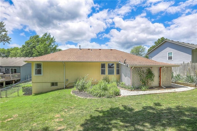 1705 N Jones Ct, Independence, MO 64056 - back of property featuring a shingled roof
