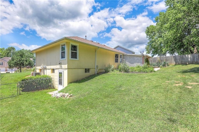 1705 N Jones Ct, Independence, MO 64056 - rear view of property with a fenced backyard