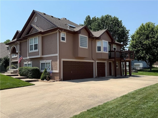 5118 SW Pelican Pt, Lees Summit, MO 64082 - view of front facade with a garage, driveway, and a shingled roof