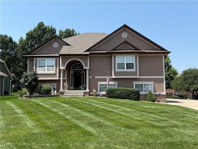5118 SW Pelican Pt, Lees Summit, MO 64082 - raised ranch featuring stucco siding and a front yard