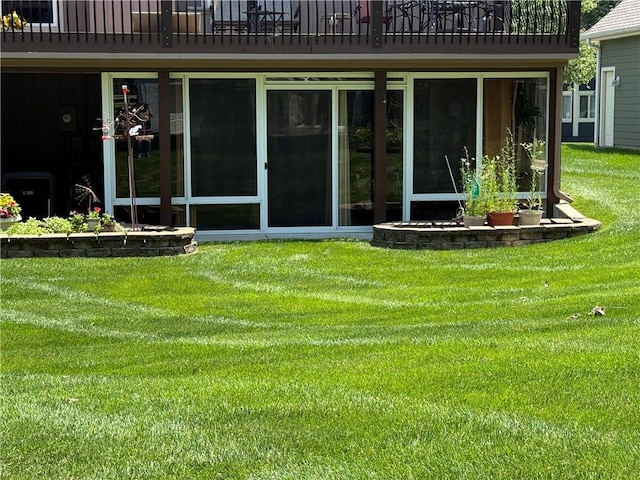 5118 SW Pelican Pt, Lees Summit, MO 64082 - rear view of house featuring a balcony and a lawn