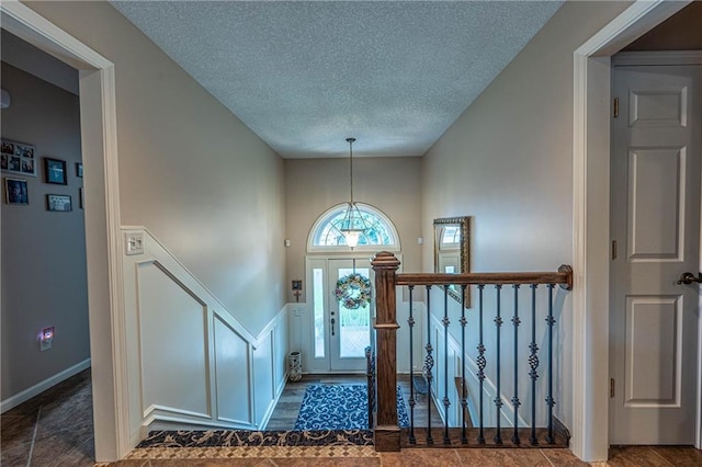 5118 SW Pelican Pt, Lees Summit, MO 64082 - foyer featuring a textured ceiling
