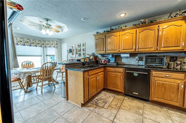 5118 SW Pelican Pt, Lees Summit, MO 64082 - kitchen featuring dishwasher, a peninsula, brown cabinets, a textured ceiling, and recessed lighting