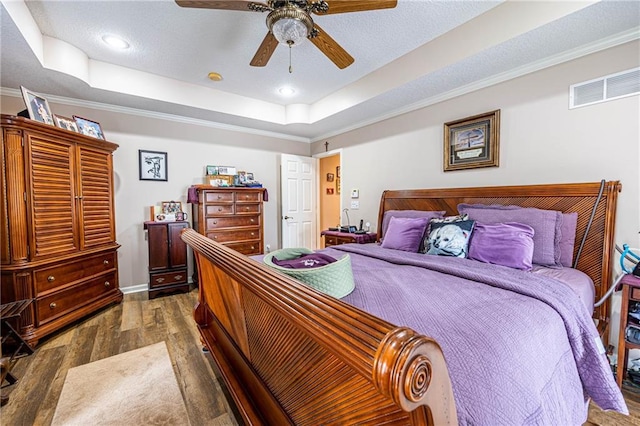 5118 SW Pelican Pt, Lees Summit, MO 64082 - bedroom with a raised ceiling, wood finished floors, ornamental molding, ceiling fan, and recessed lighting