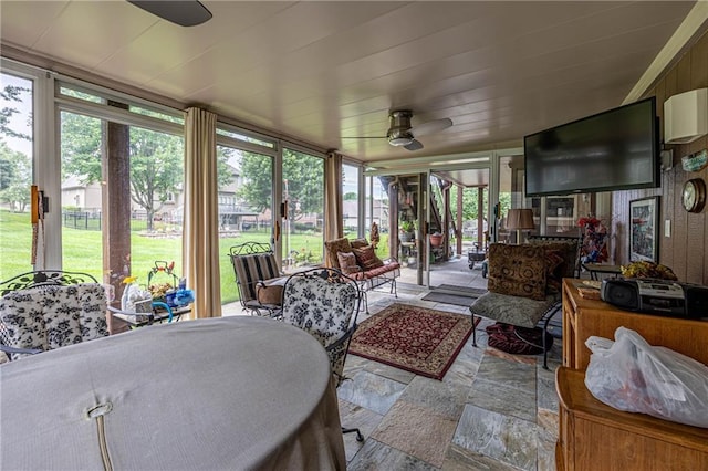 5118 SW Pelican Pt, Lees Summit, MO 64082 - sunroom / solarium featuring a ceiling fan, outdoor dining area, and plenty of natural light