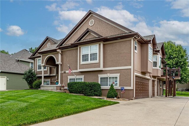 5118 SW Pelican Pt, Lees Summit, MO 64082 - view of front of property with driveway, a front lawn, stucco siding, and an attached garage