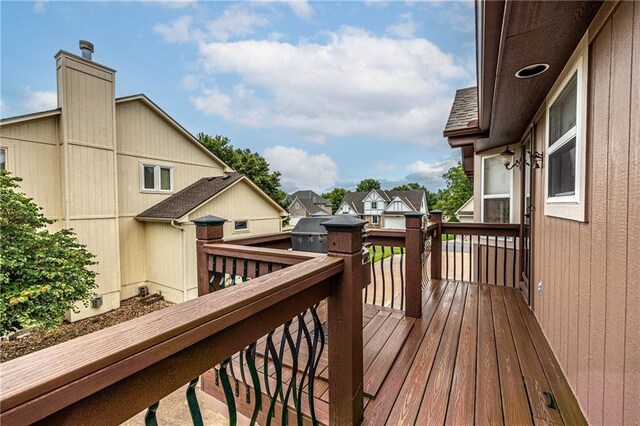 5118 SW Pelican Pt, Lees Summit, MO 64082 - wooden deck featuring a residential view
