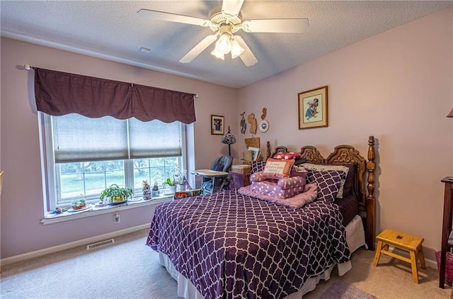 5118 SW Pelican Pt, Lees Summit, MO 64082 - bedroom featuring carpet flooring, a ceiling fan, and a textured ceiling