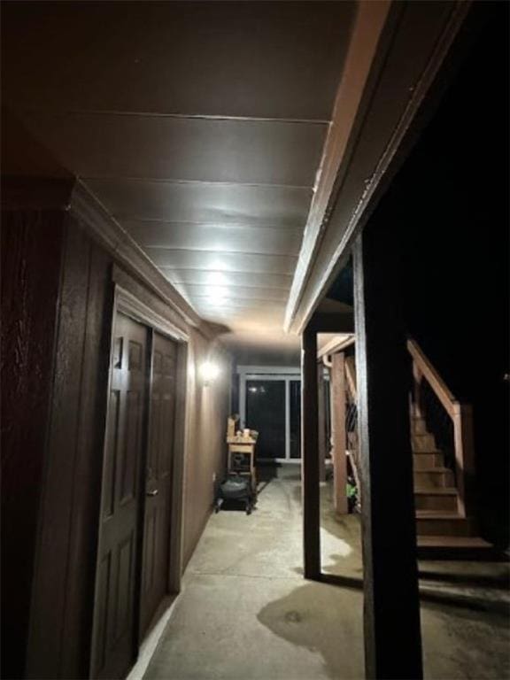5118 SW Pelican Pt, Lees Summit, MO 64082 - hall with unfinished concrete flooring and stairs