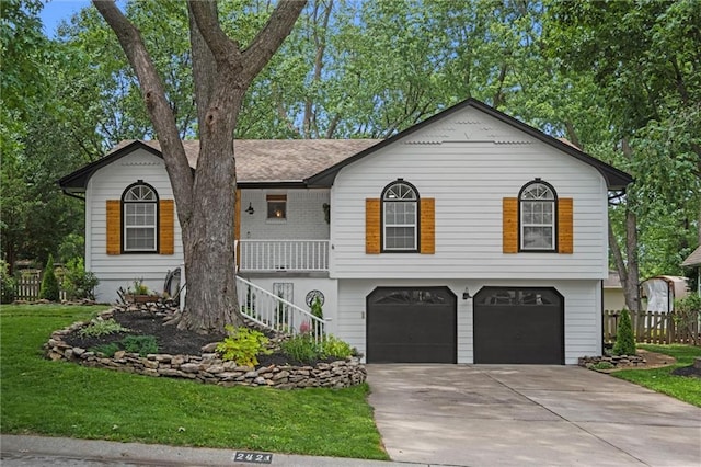 2421 NW Acorn Dr, Blue Springs, MO 64014 - view of front facade with a garage, stairs, driveway, and a porch