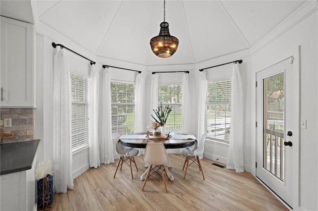2421 NW Acorn Dr, Blue Springs, MO 64014 - dining room featuring light wood-style flooring, healthy amount of natural light, and vaulted ceiling