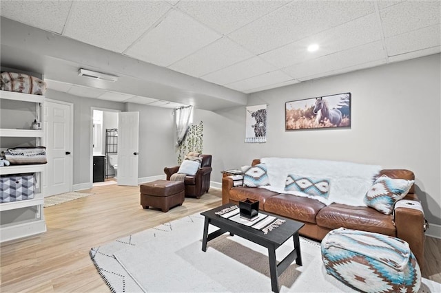 2421 NW Acorn Dr, Blue Springs, MO 64014 - living area featuring wood finished floors, a drop ceiling, and recessed lighting