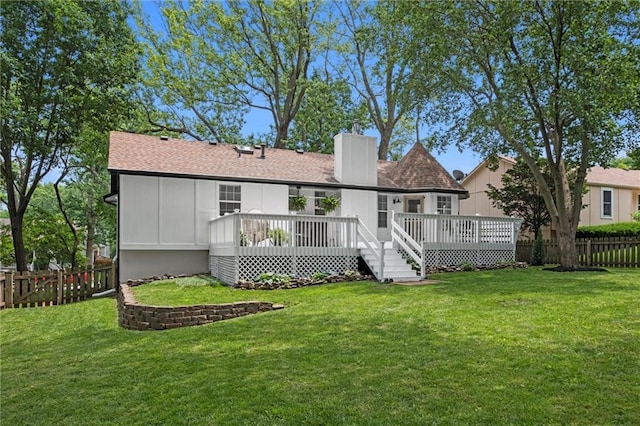 2421 NW Acorn Dr, Blue Springs, MO 64014 - rear view of house featuring a chimney, a fenced backyard, a wooden deck, and a shingled roof