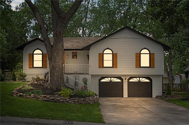 2421 NW Acorn Dr, Blue Springs, MO 64014 - view of front facade featuring an attached garage, driveway, stairs, a front lawn, and a porch