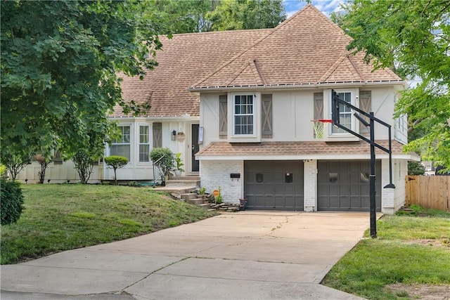 6101 E 107th St, Kansas City, MO 64134 - tri-level home with an attached garage, driveway, roof with shingles, and stucco siding