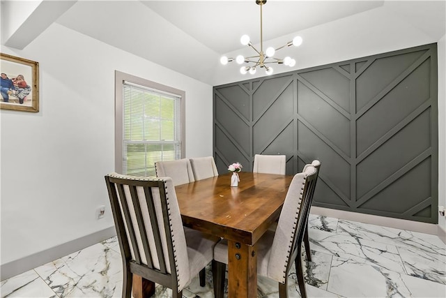 6101 E 107th St, Kansas City, MO 64134 - dining area with light marble finish floors and a chandelier