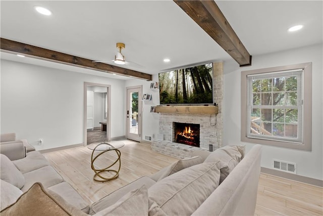 6101 E 107th St, Kansas City, MO 64134 - living area featuring beam ceiling, recessed lighting, a fireplace, light wood-type flooring, and a ceiling fan