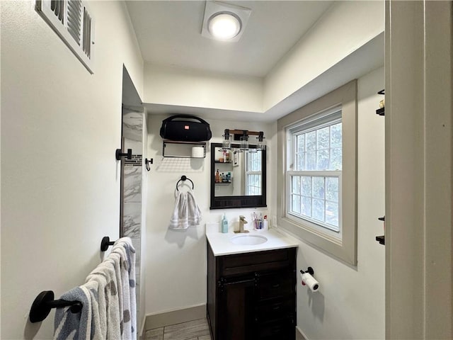 6101 E 107th St, Kansas City, MO 64134 - bathroom with vanity and baseboards