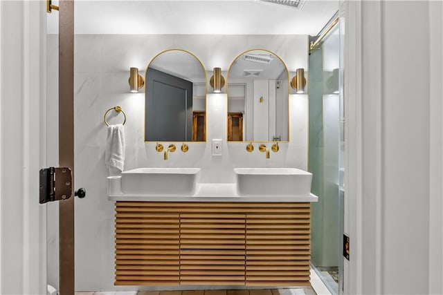 6101 E 107th St, Kansas City, MO 64134 - bathroom featuring double vanity and tile walls