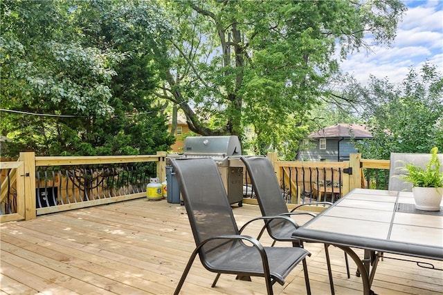 6101 E 107th St, Kansas City, MO 64134 - wooden terrace featuring outdoor dining area and area for grilling