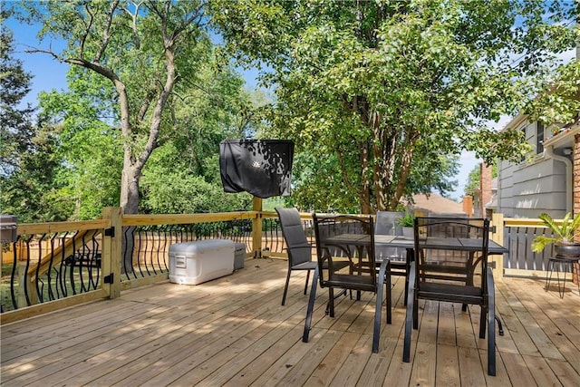 6101 E 107th St, Kansas City, MO 64134 - wooden deck with outdoor dining area