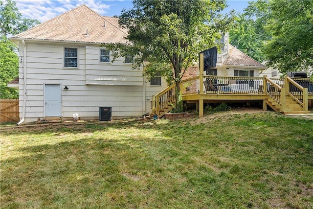 6101 E 107th St, Kansas City, MO 64134 - rear view of property with stairway, a deck, and roof with shingles