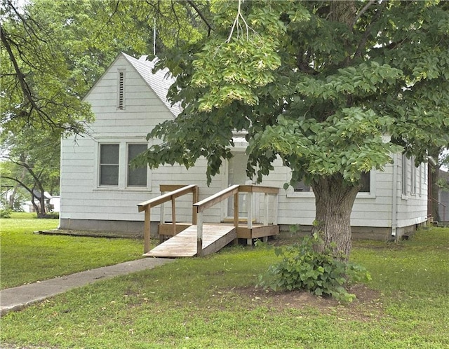 103 N Missouri St, Adrian, MO 64720 - rear view of house with a lawn